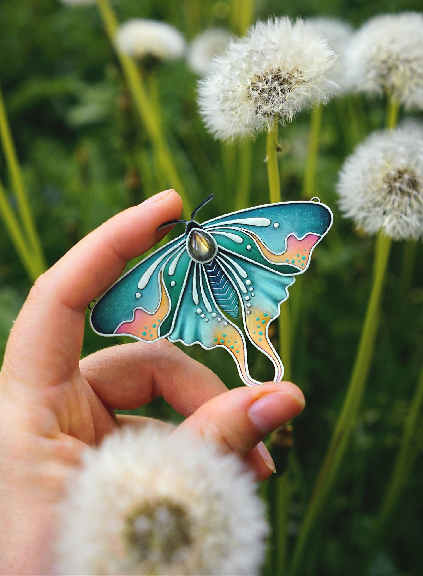Glow in the dark moth pendant