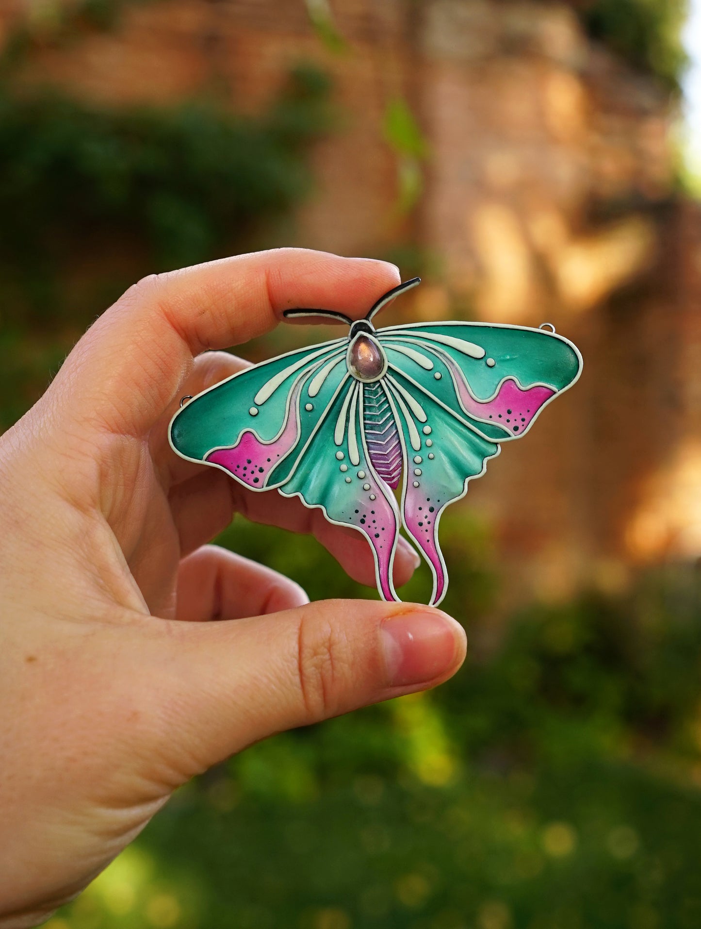 Glow in the dark moth pendant
