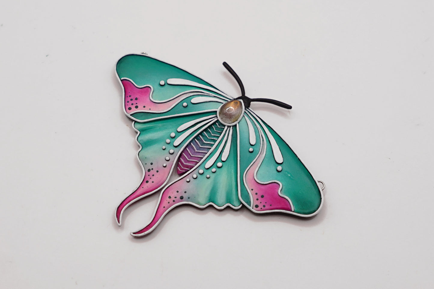 Glow in the dark moth pendant