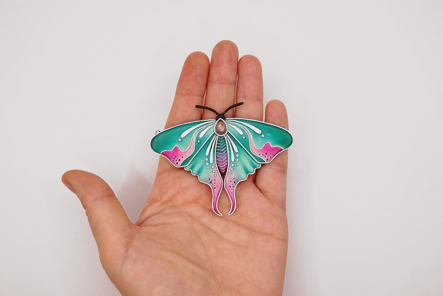 Glow in the dark moth pendant