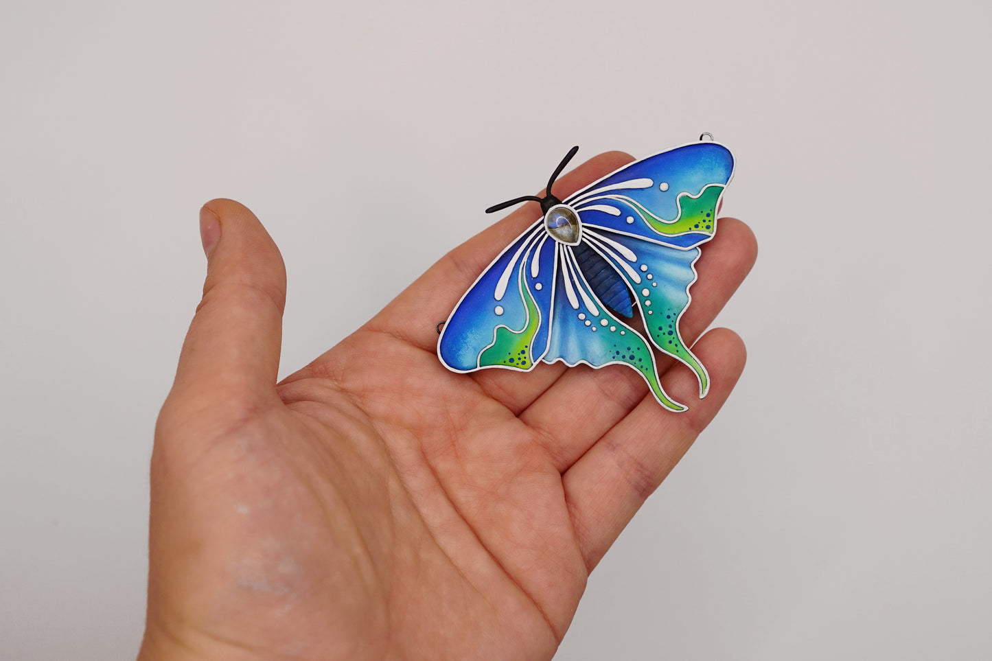 Glow in the dark moth pendant