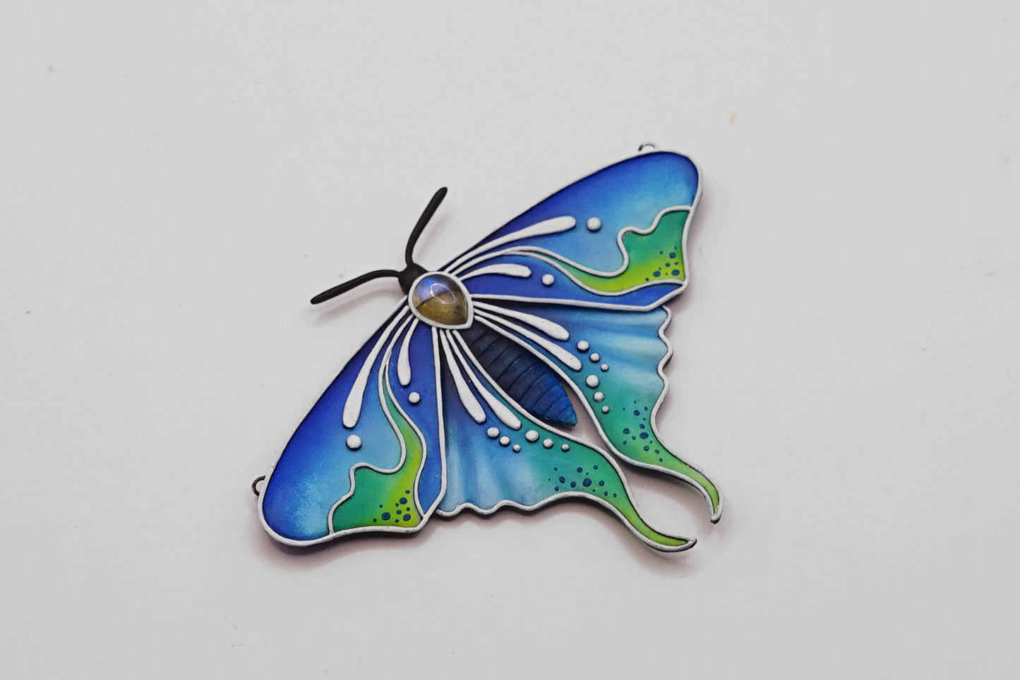 Glow in the dark moth pendant