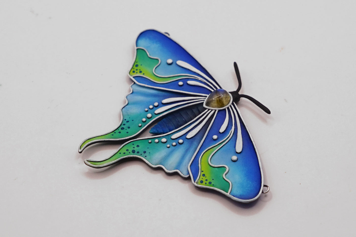 Glow in the dark moth pendant
