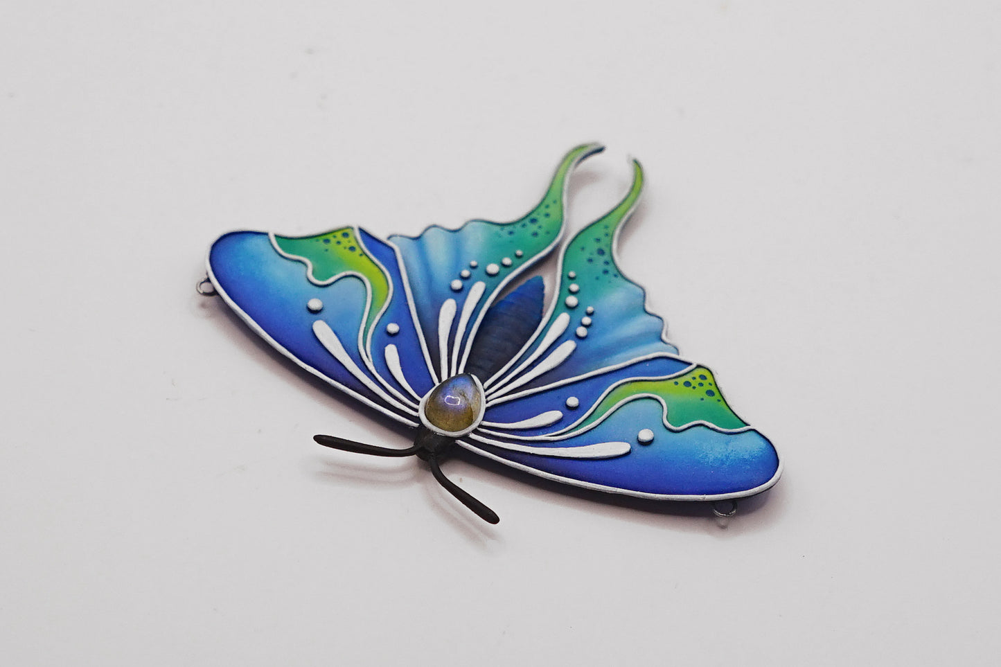 Glow in the dark moth pendant