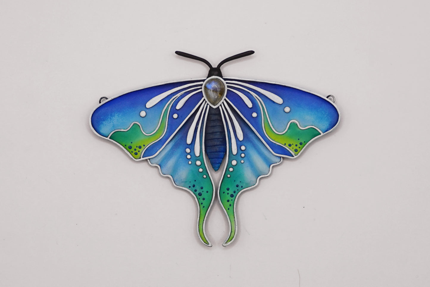 Glow in the dark moth pendant
