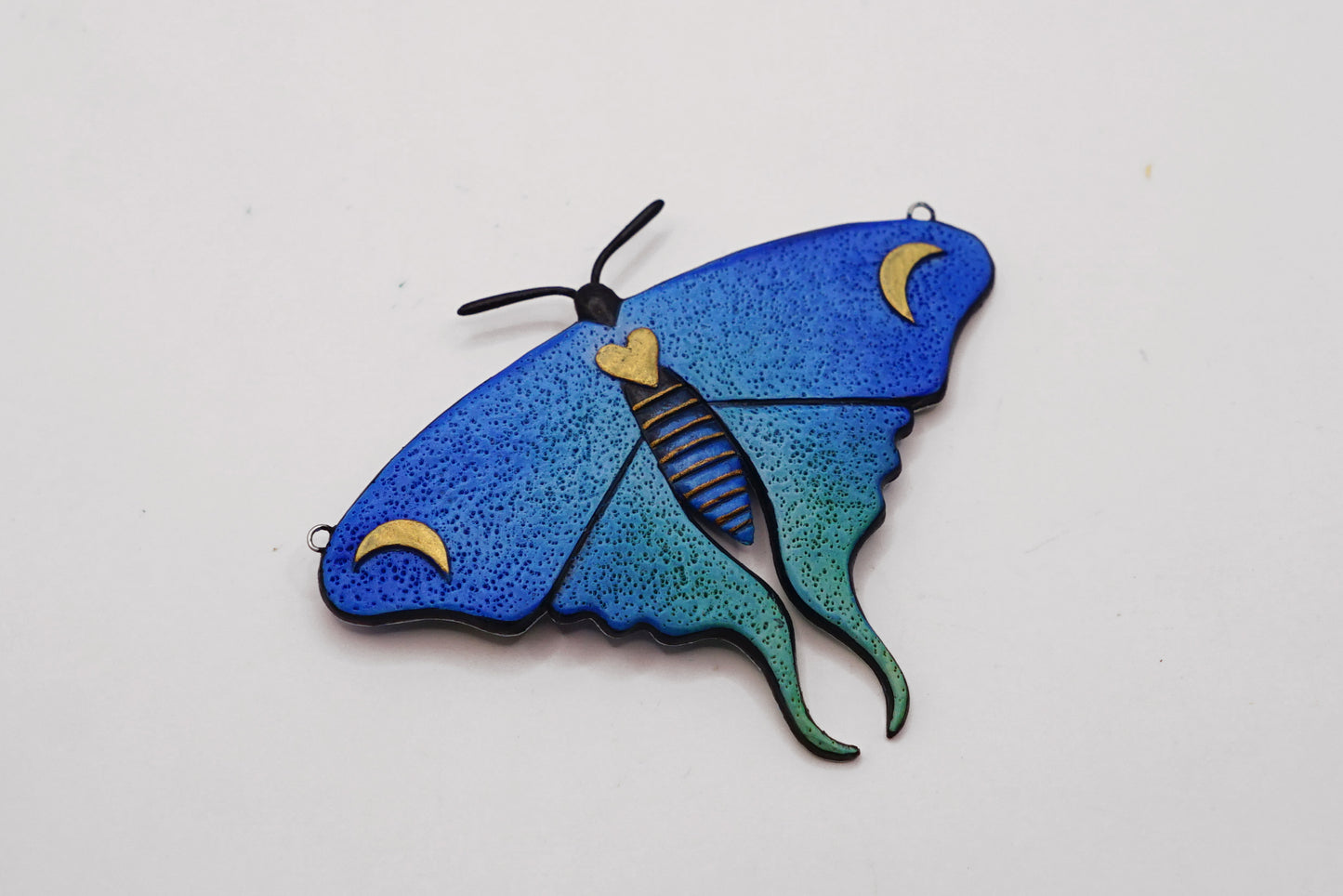 Glow in the dark moth pendant