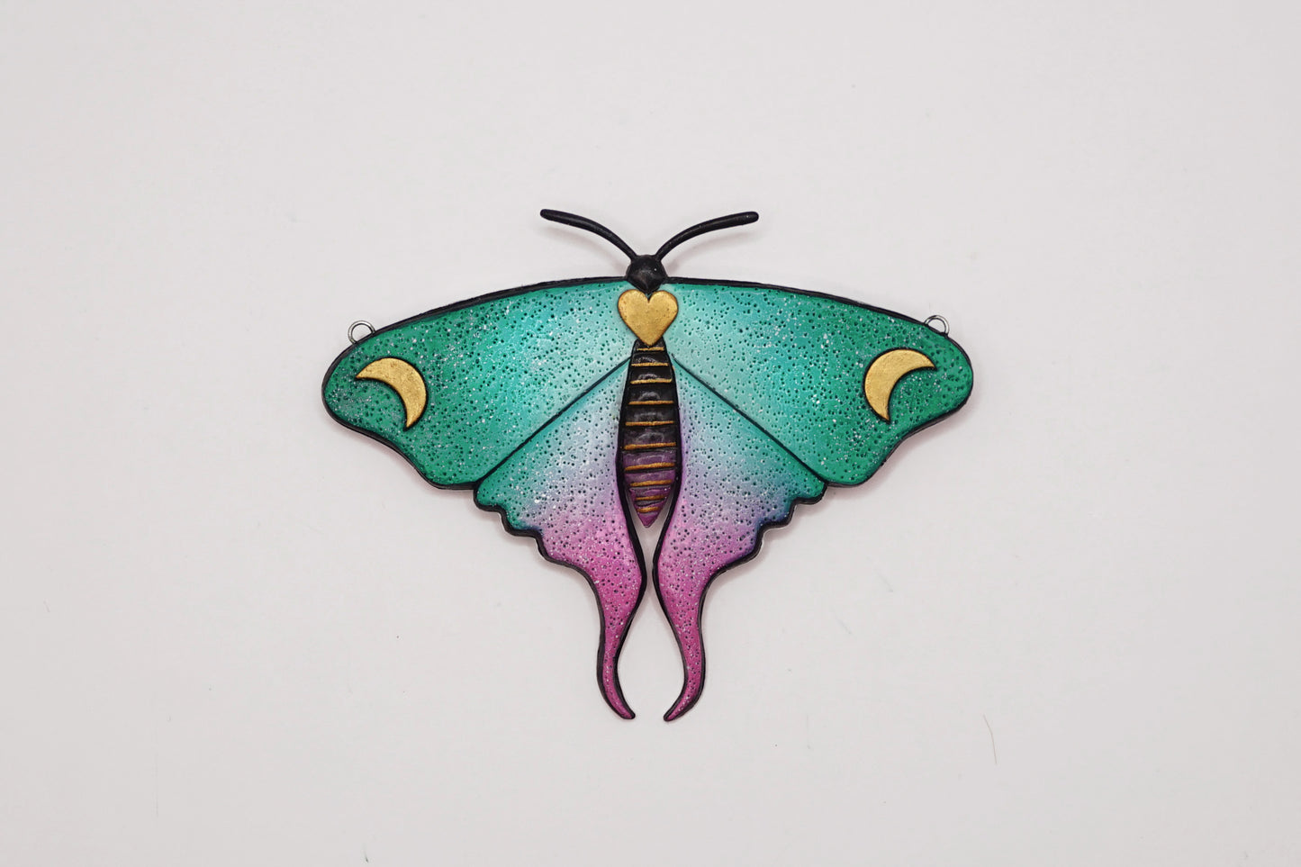 Glow in the dark moth pendant