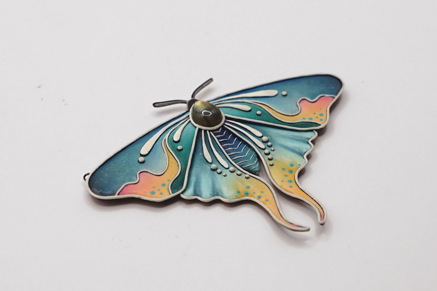 Glow in the dark moth pendant