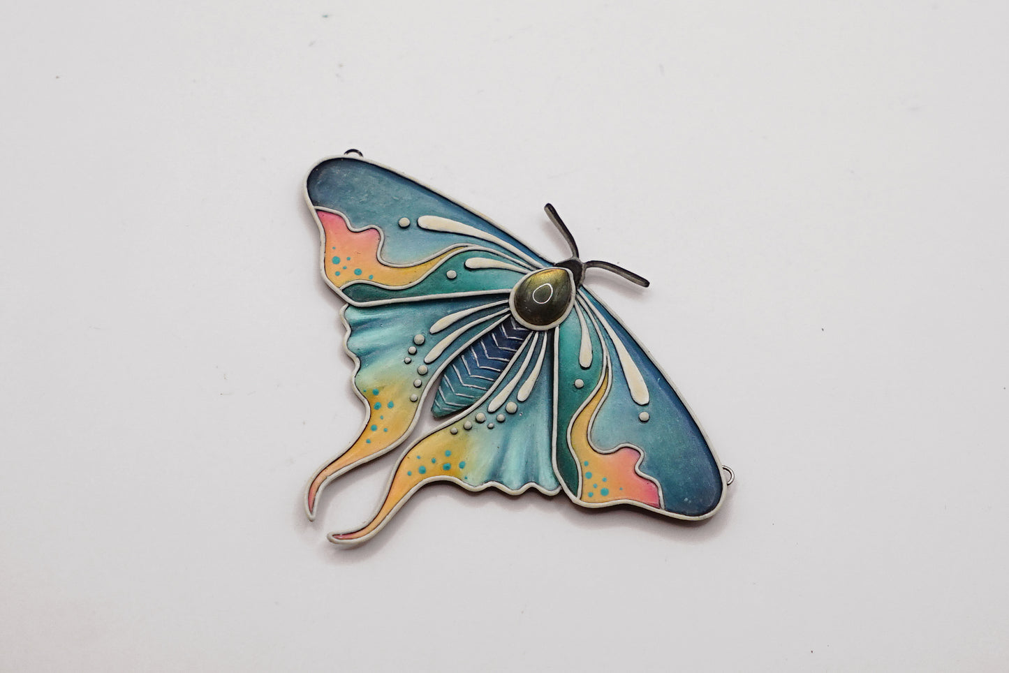 Glow in the dark moth pendant