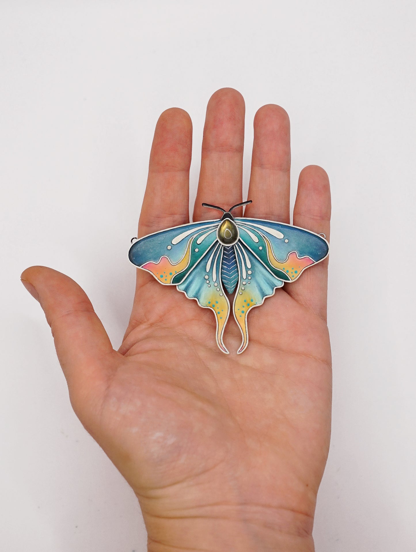 Glow in the dark moth pendant