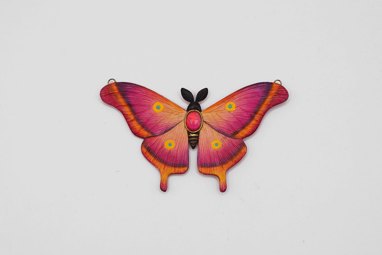 Pink moth pendant