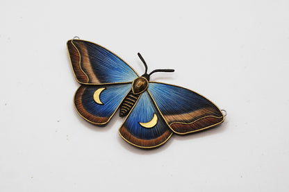 Decorative butterfly with blue and brown colors on a white background