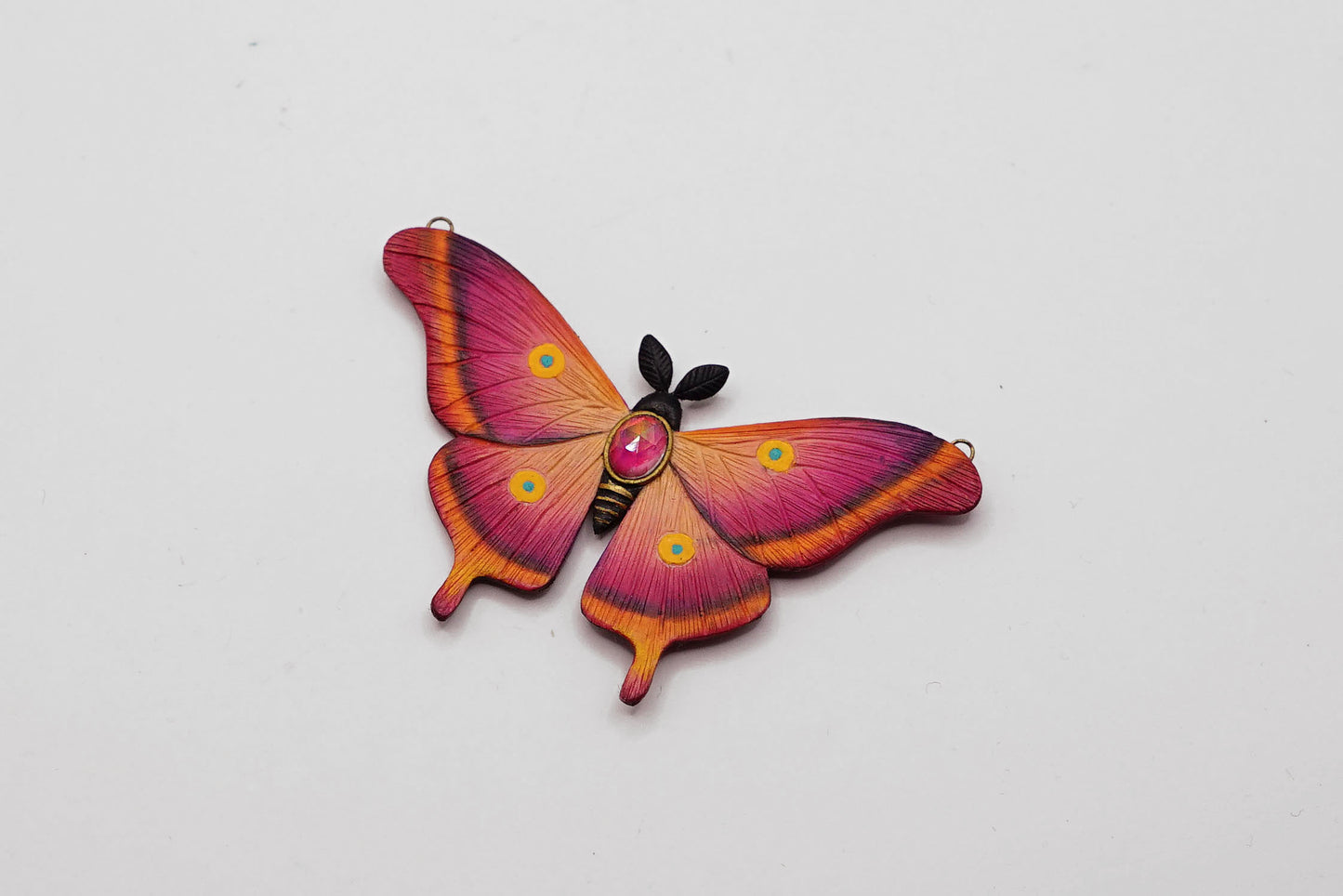 Pink moth pendant