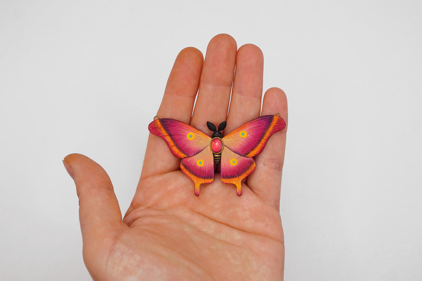 Pink moth pendant