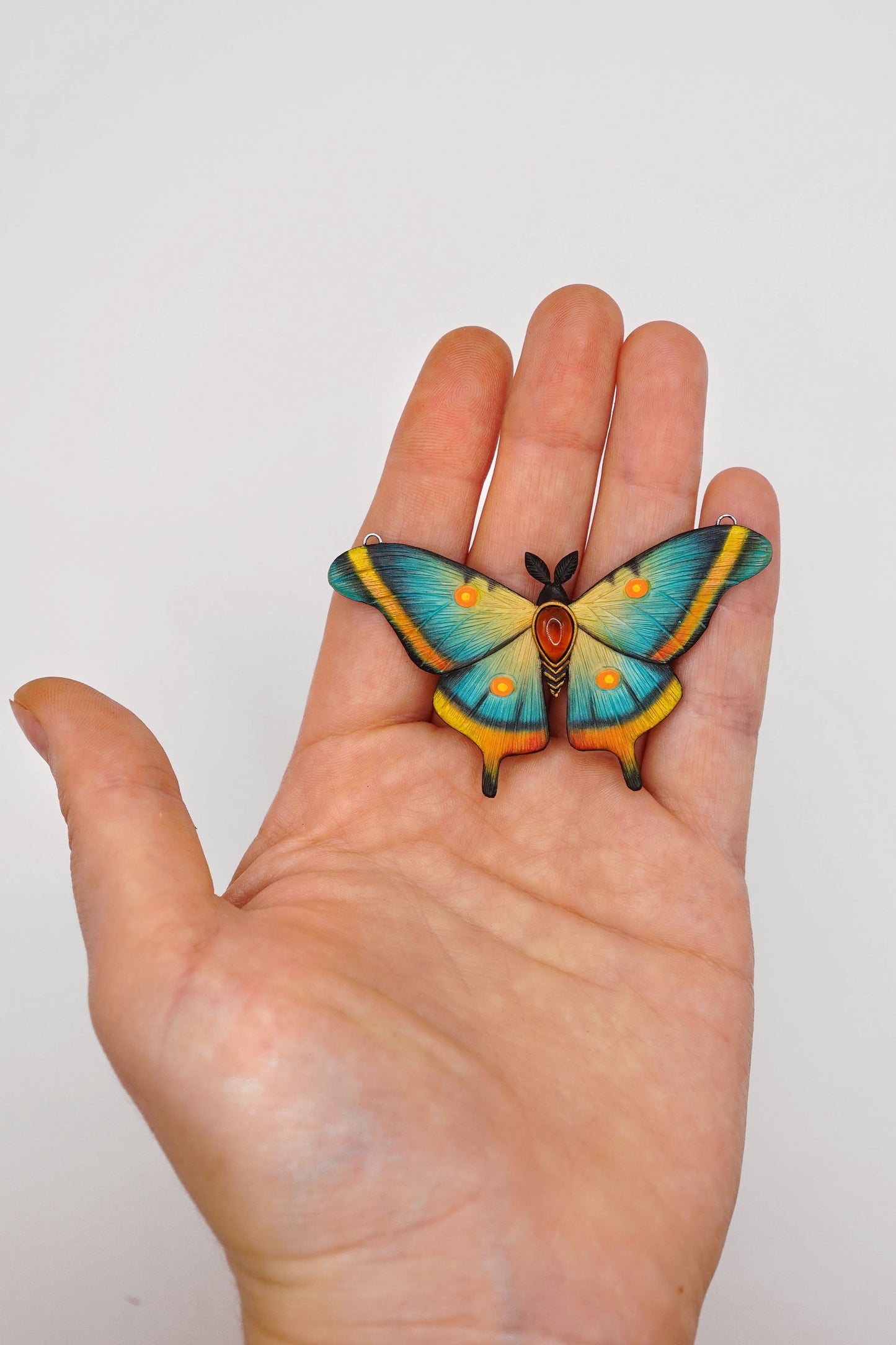 Blue moth pendant