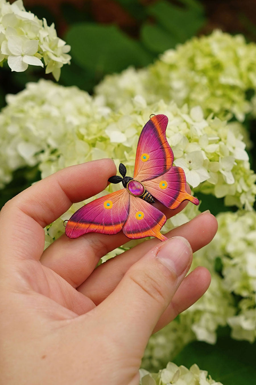 Pink moth pendant