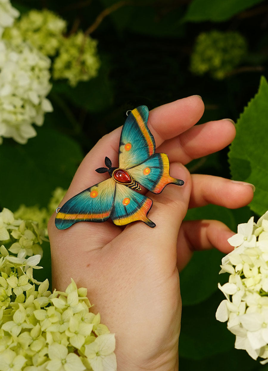 Blue moth pendant