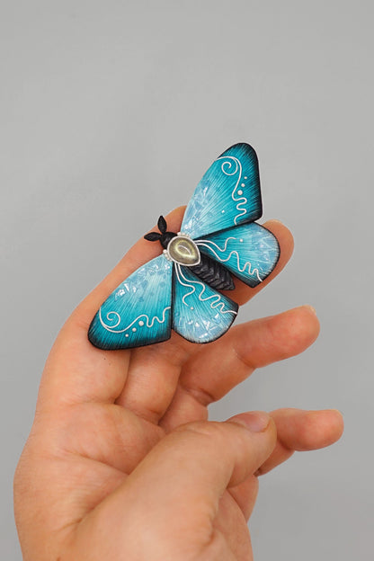 Icy moth brooch