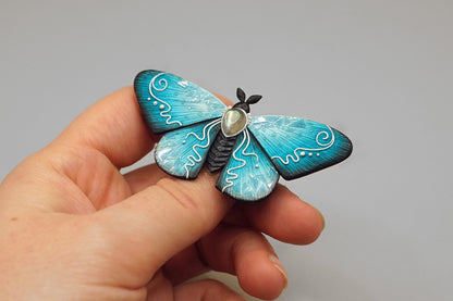 Icy moth brooch