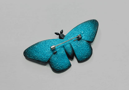 Icy moth brooch