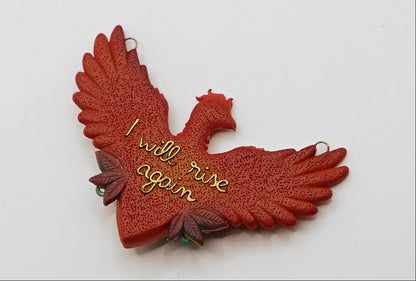 Red phoenix ornament with 'I will rise again' text on a white background