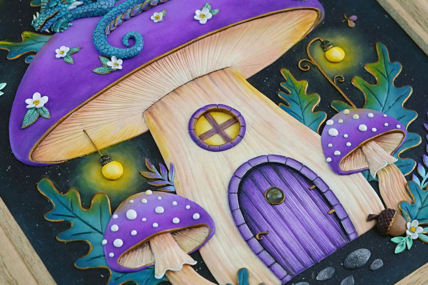 A close-up of a whimsical fairy tale mushroom house with a large purple cap, wooden-textured beige body, purple door, and smaller matching mushrooms around it on a dark background.